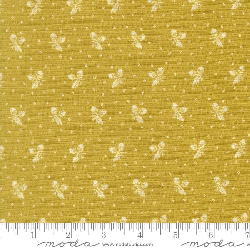 Image of Butternut and Sage Acorn Medley Citron quilting cotton fabric by Fig Tree Co for Moda Fabrics. Features acorns and dots on a green background. Cute Little Fabric Shop.