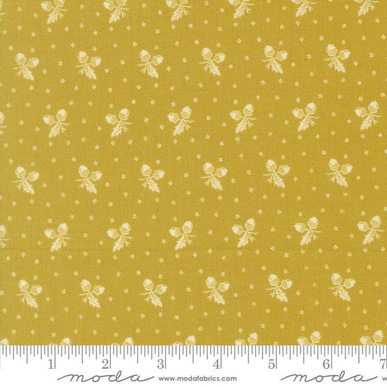 Image of Butternut and Sage Acorn Medley Citron quilting cotton fabric by Fig Tree Co for Moda Fabrics. Features acorns and dots on a green background. Cute Little Fabric Shop.