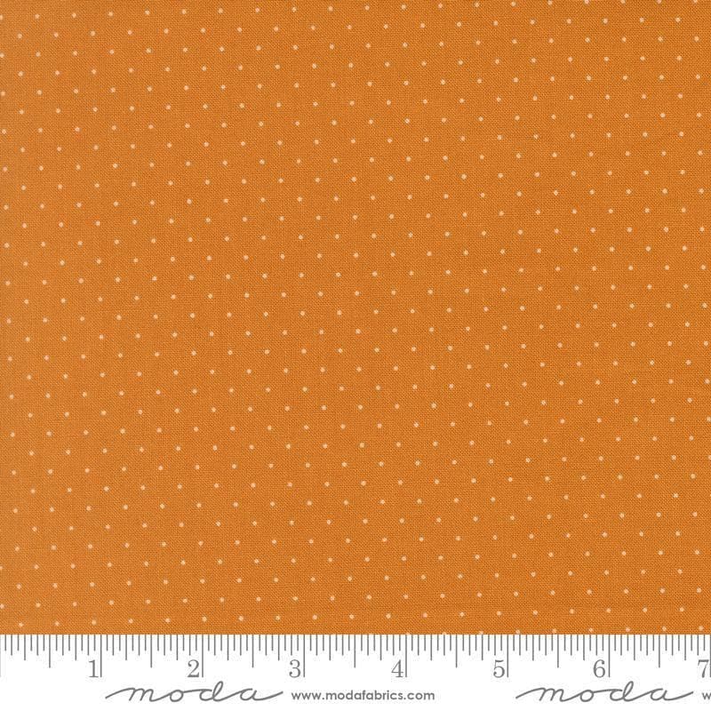 Image of Butternut and Sage Pindot Butterscotch quilting cotton fabric by Fig Tree Co for Moda Fabrics. Features polka dots on an orange background. Cute Little Fabric Shop.