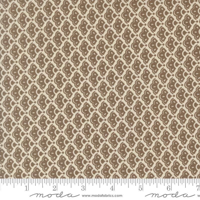 Image of Butternut and Sage Cobblestones Walnut quilting cotton fabric by Fig Tree Co for Moda Fabrics. Features a geometric pattern on a brown background. Cute Little Fabric Shop.