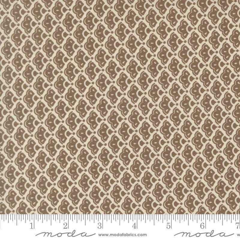 Image of Butternut and Sage Cobblestones Walnut quilting cotton fabric by Fig Tree Co for Moda Fabrics. Features a geometric pattern on a brown background. Cute Little Fabric Shop.