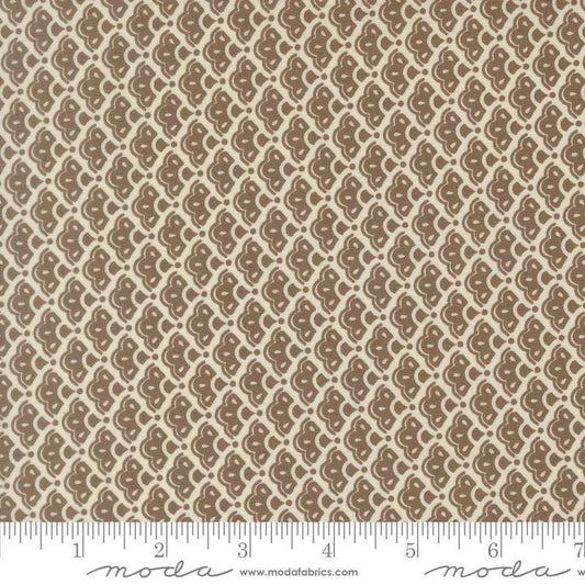 Image of Butternut and Sage Cobblestones Walnut quilting cotton fabric by Fig Tree Co for Moda Fabrics. Features a geometric pattern on a brown background. Cute Little Fabric Shop.