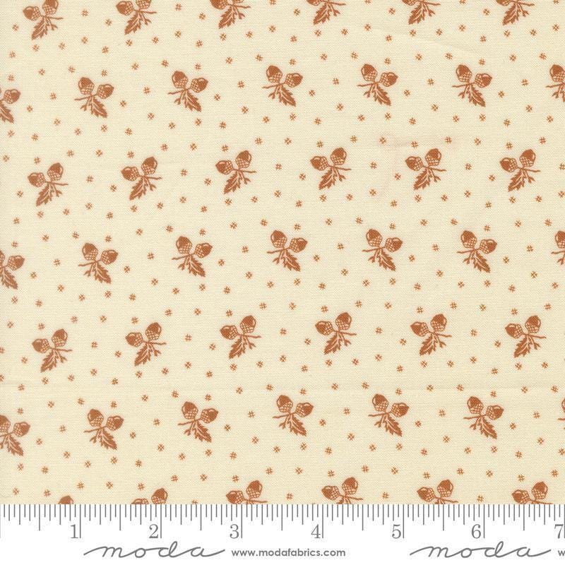 Image of Butternut and Sage Acorn Medley Cream Cinnamon quilting cotton fabric by Fig Tree Co for Moda Fabrics. Features acorns and dots on a cream background. Cute Little Fabric Shop.