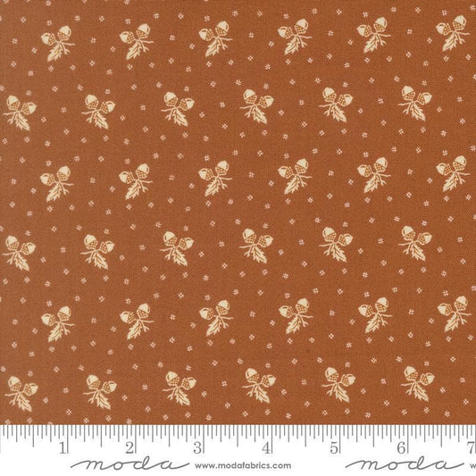 Image of Butternut and Sage Acorn Medley Cinnamon quilting cotton fabric by Fig Tree Co for Moda Fabrics. Features acorns and dots on a brown background. Cute Little Fabric Shop.
