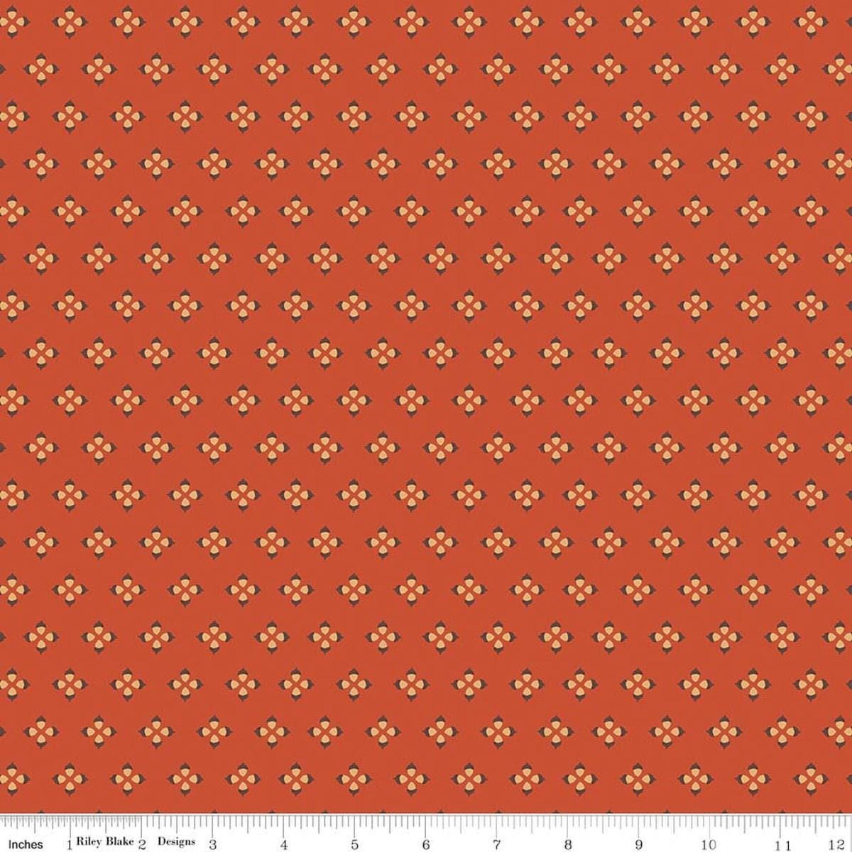 Image of Cozy Autumn Tiny Acorns Rusty quilting cotton fabric by Beverly McCullough for Riley Blake Designs. Features tiny acorns on an orange background. Cute Little Fabric Shop.