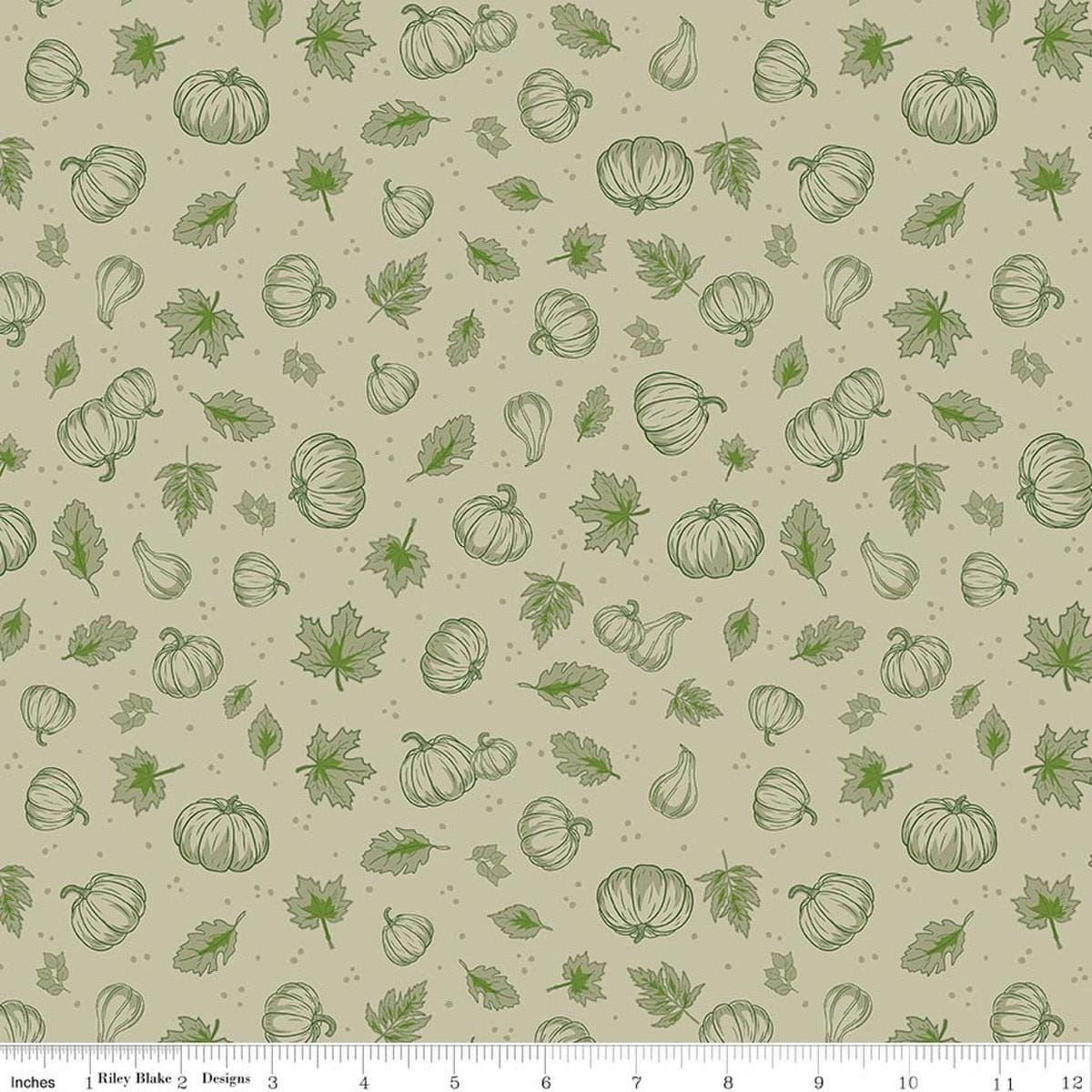 Image of Cozy Autumn Pumpkins Meadow quilting cotton fabric by Beverly McCullough for Riley Blake Designs. Features pumpkins and leaves on a green background. Cute Little Fabric Shop.