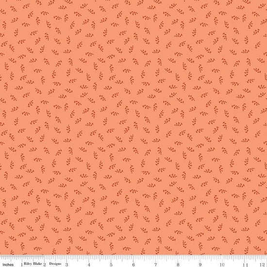 Image of Cozy Autumn Vines Melon quilting cotton fabric by Beverly McCullough for Riley Blake Designs. Features leaves on a pinky orange background. Cute Little Fabric Shop.