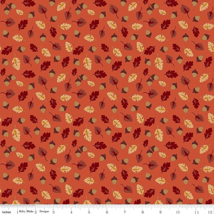 Image of Cozy Autumn Acorns & Oak Leaves Rusty quilting cotton fabric by Beverly leaves and acorns for Riley Blake Designs. Features leaves and acorns on an orange background. Cute Little Fabric Shop.