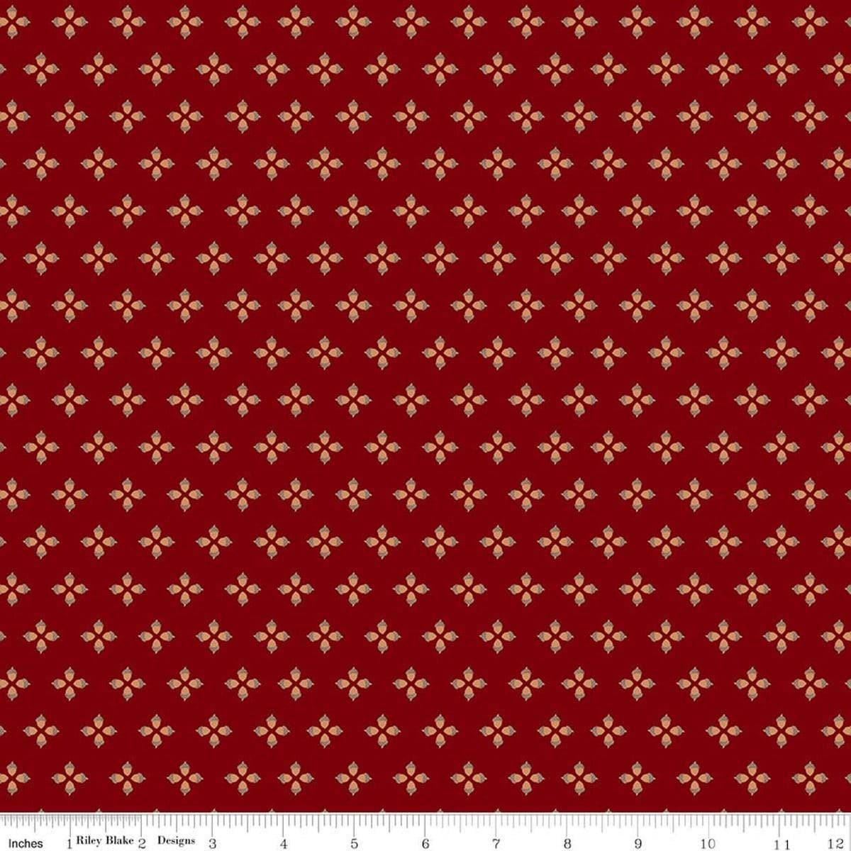 Image of Cozy Autumn Tiny Acorns Mahogany quilting cotton fabric by Beverly McCullough for Riley Blake Designs. Features tiny acorns on a red background. Cute Little Fabric Shop.