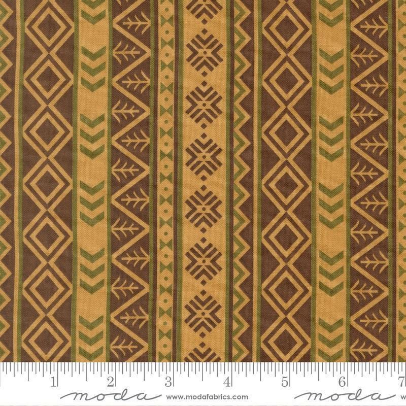 Image of Northwoods Lodge Northwest Stripes Fawn quilting cotton fabric by Deb Strain for Moda Fabrics. Features geometric stripes on a brown background. Cute Little Fabric Shop.