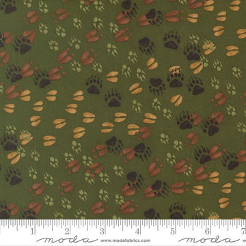 Image of Northwoods Lodge Animal Tracks Pine quilting cotton fabric by Deb Strain for Moda Fabrics. Features animal footprints on a green background. Cute Little Fabric Shop.