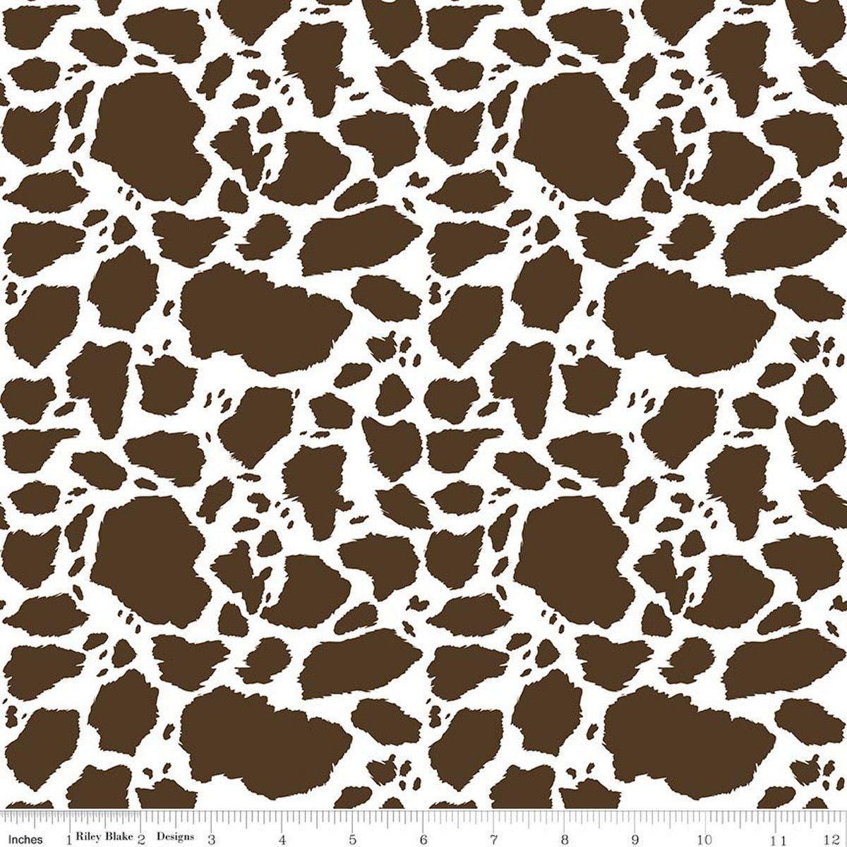 Image of The Homestead Cow Patches Brown quilting cotton fabric by Tara Reed for Riley Blake Designs. Features cow print on a brown background. Cute Little Fabric Shop.