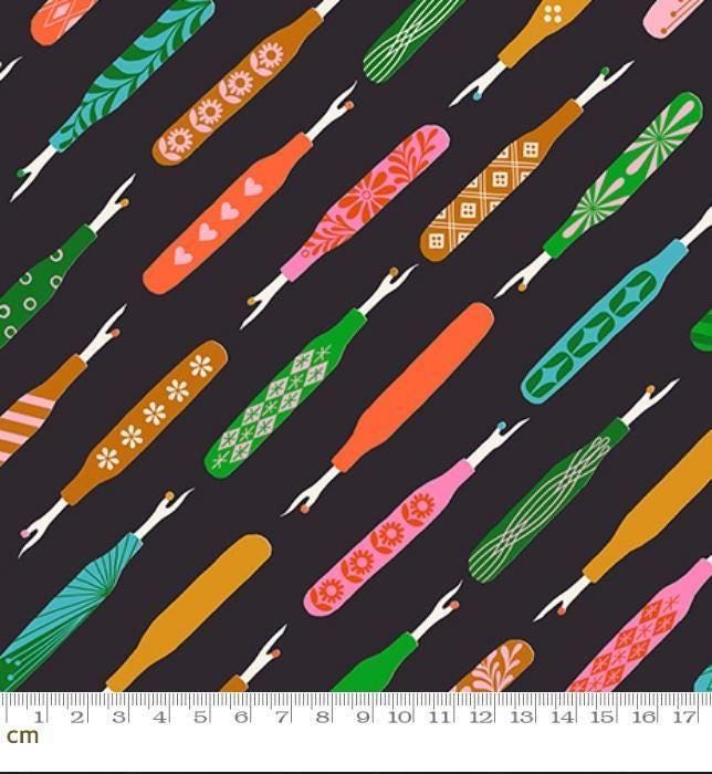 Image of 1 800 Notion Seam Rippers Soft Black quilting cotton fabric by Ruby Star Society for Moda Fabrics. Features sewing accessories on a black background. Cute Little Fabrics Shop.