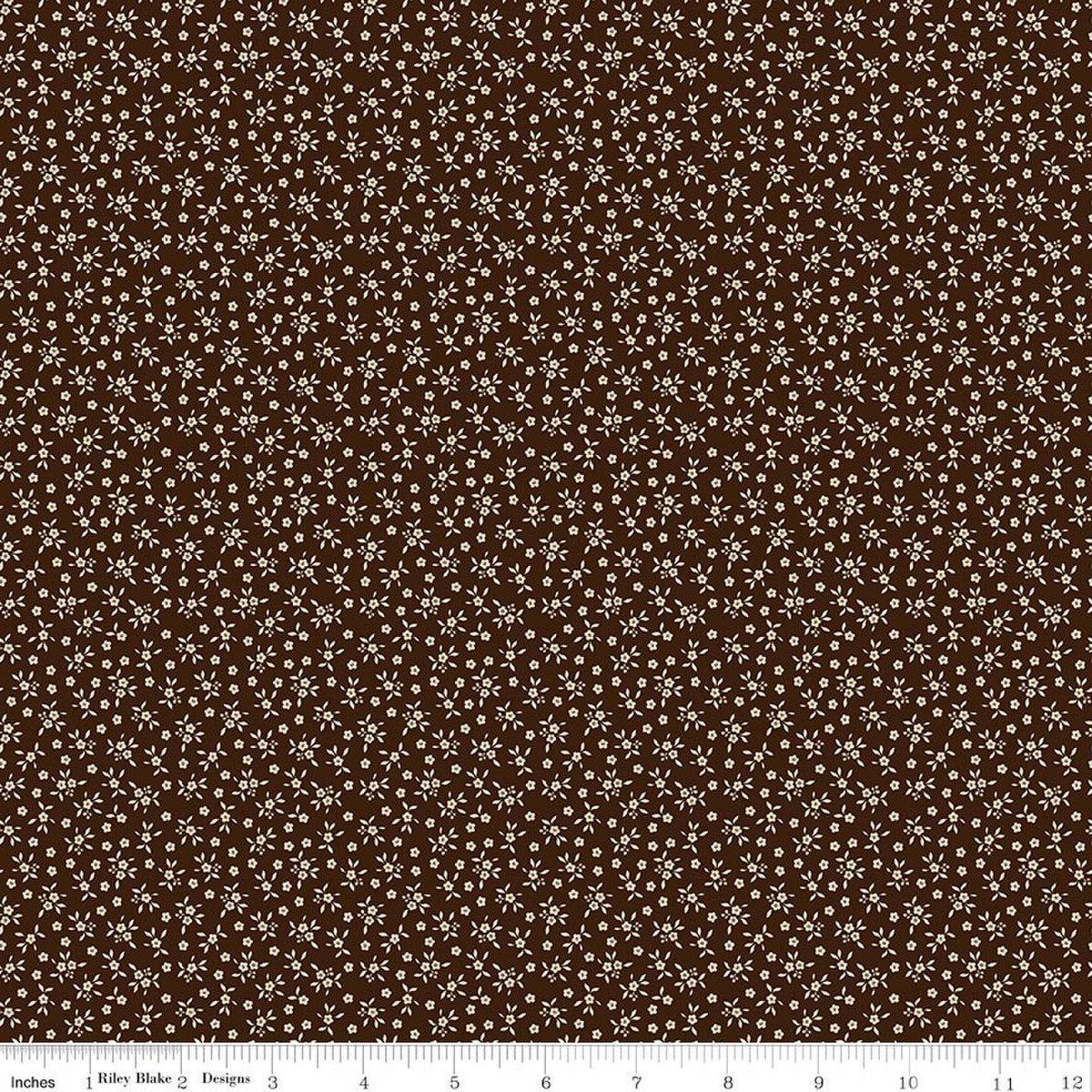 Image of Worth Repeating Ditsy Coffee quilting cotton fabric by Sandy Gervais for Riley Blake Designs. Features flowers on a brown background. Cute Little Fabric Shop.