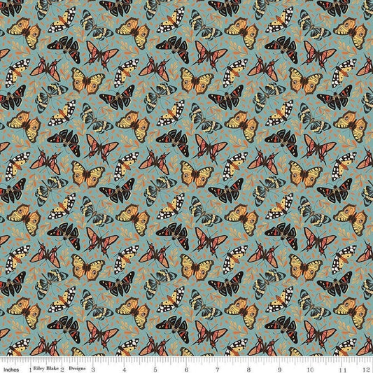 Image of Secret Garden Moths Wedgewood quilting cotton fabric by Amanda Castor for Riley Blake Designs. Features bugs on a blue background. Cute Little Fabric Shop.