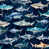 Image of Into the Deep Sharks Mediterranean quilting cotton fabric by Morris Creative Group for QT Fabrics. Features sharks on a blue background. Cute Little Fabric Shop.