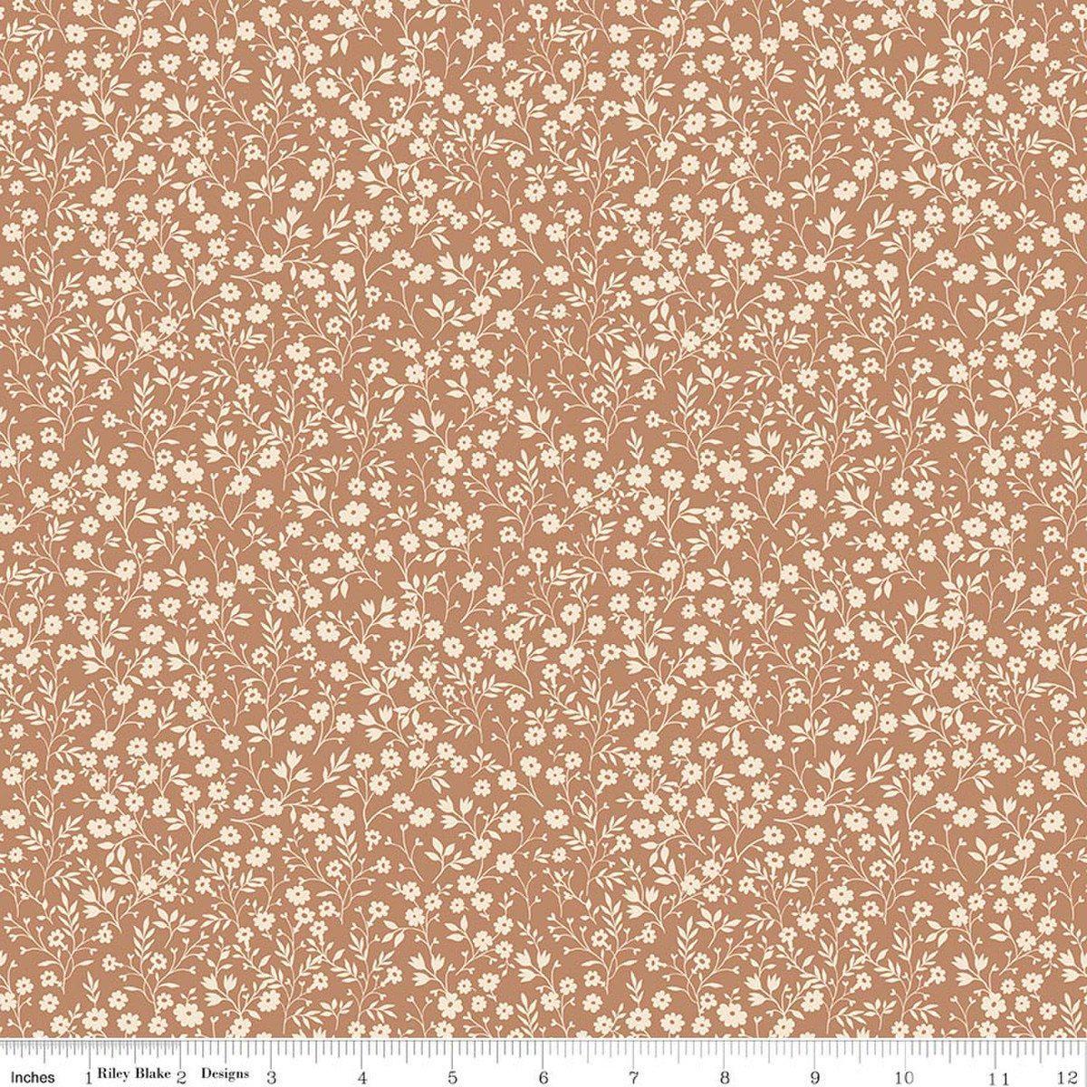 Image of Harvest on the Prairie Ditsy Suede quilting cotton fabric by Modern Prairie for Riley Blake Designs. Features flowers on a brown background. Cute Little Fabric Shop.