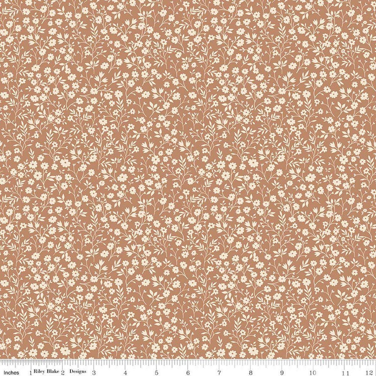 Image of Harvest on the Prairie Ditsy Suede quilting cotton fabric by Modern Prairie for Riley Blake Designs. Features flowers on a brown background. Cute Little Fabric Shop.