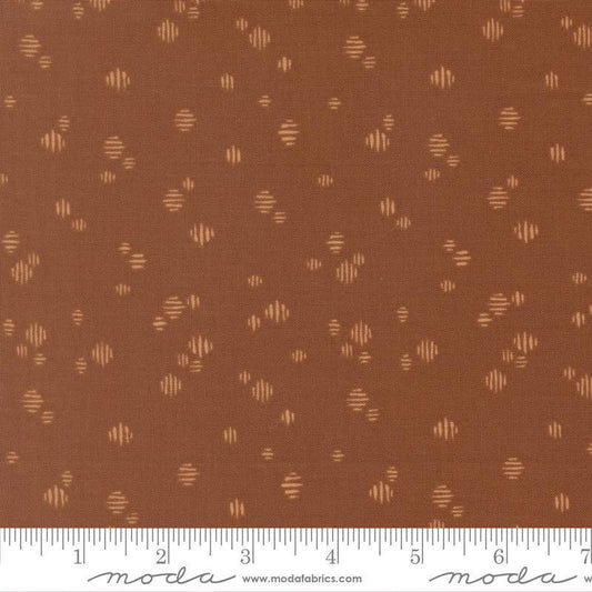 Image of Wellspring Dashed Dark Clay quilting cotton fabric by Fancy That Design House for Moda Fabrics. Features dots on a brown background. Cute Little Fabric Shop.
