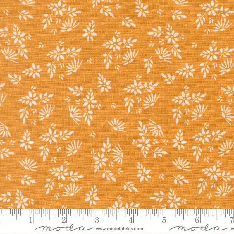 Image of Birch and Willow Flora Golden quilting cotton fabric by Sherri & Chelsi for Moda Fabrics. Features leaves on a gold background. Cute Little Fabric Shop.