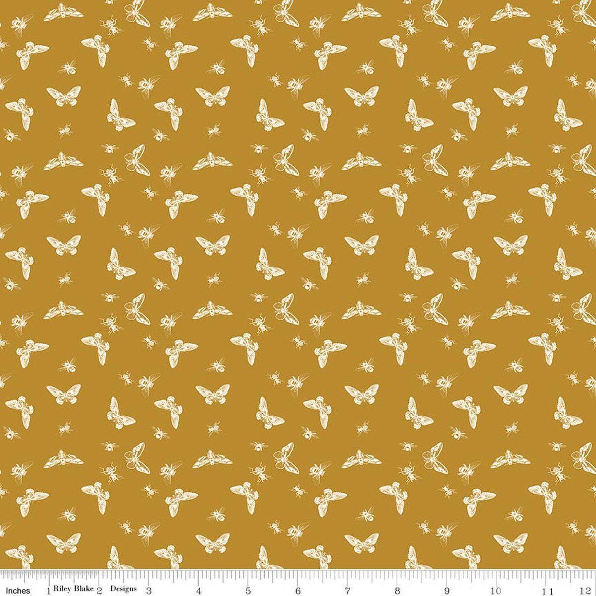 Image of Petals & Hazel Flutter Butterscotch quilting cotton fabric by Simple Simon & Company for Riley Blake Designs. Features butterflies on a gold background. Cute Little Fabric Shop.