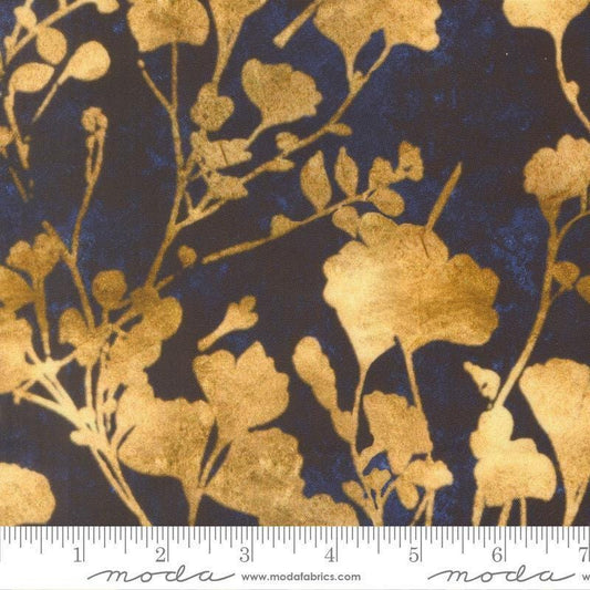 Image of Tranquil Patina Ginkgo Glow Midnight quilting cotton fabric by Debbie Maddy for Moda Fabrics. Features leaves on a blue background. Cute Little Fabric Shop.