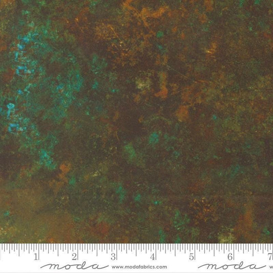 Image of Tranquil Patina Grounding Dark Teal quilting cotton fabric by Debbie Maddy for Moda Fabrics. Features printed texture on a blue and brown background. Cute Little Fabric Shop.
