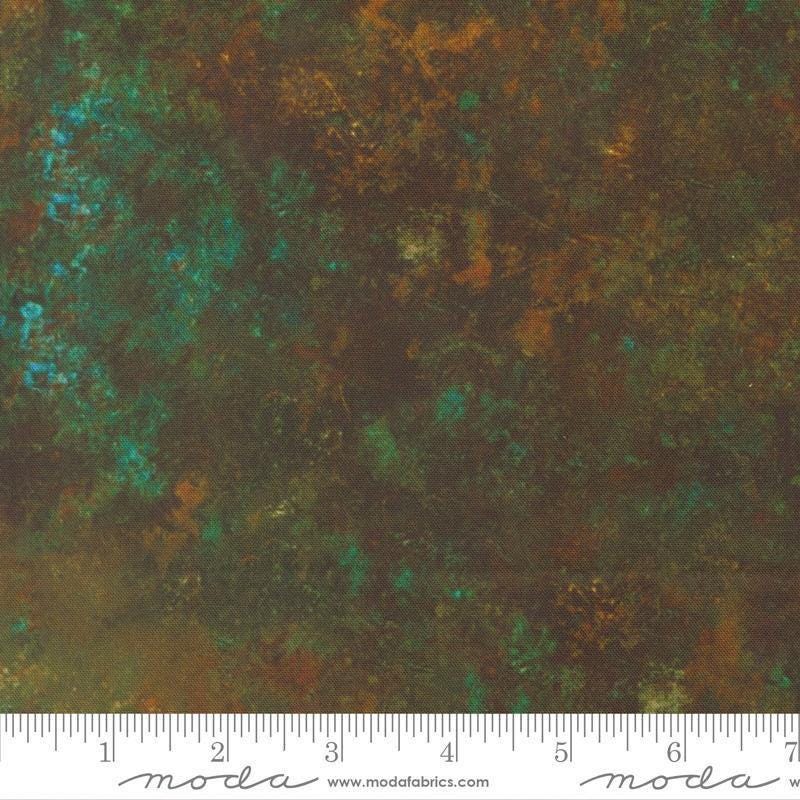 Image of Tranquil Patina Grounding Dark Teal quilting cotton fabric by Debbie Maddy for Moda Fabrics. Features printed texture on a blue and brown background. Cute Little Fabric Shop.