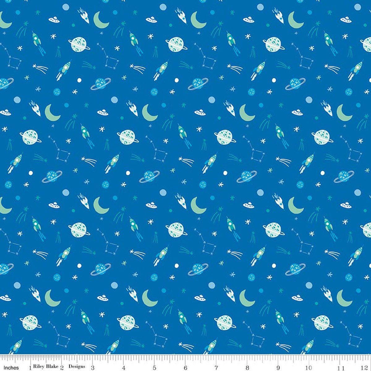 Image of Brave Your Way To the Moon Cobalt quilting cotton fabric by Cayla Naylor for Riley Blake Designs. Features space on a blue background. Cute Little Fabric Shop.