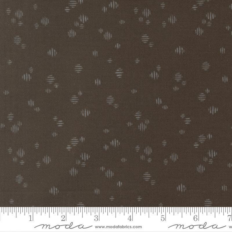 Image of Wellspring Dashed Charcoal quilting cotton fabric by Fancy That Design House for Moda Fabrics. Features dots on a black background. Cute Little Fabric Shop.