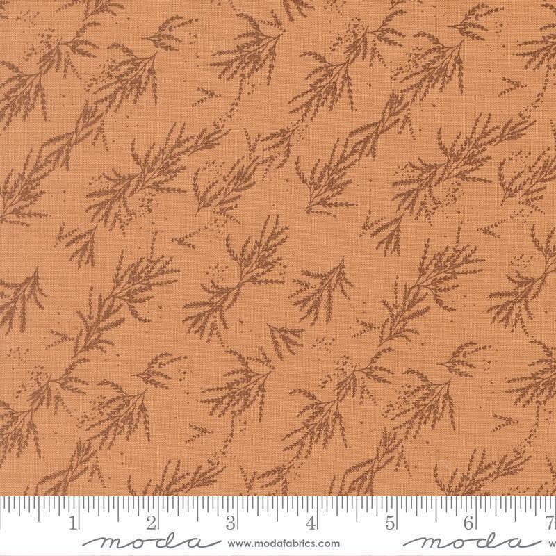 Image of Wellspring Branches Coral Seashell quilting cotton fabric by Fancy That Design House for Moda Fabrics. Features leaves on a brown background. Cute Little Fabric Shop.
