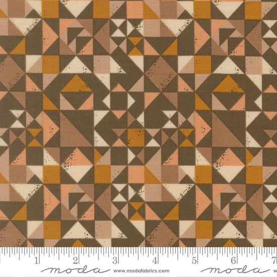 Image of Wellspring Quilt Blocked Earth quilting cotton fabric by Fancy That Design House for Moda Fabrics. Features a geometric pattern on a brown background. Cute Little Fabric Shop.