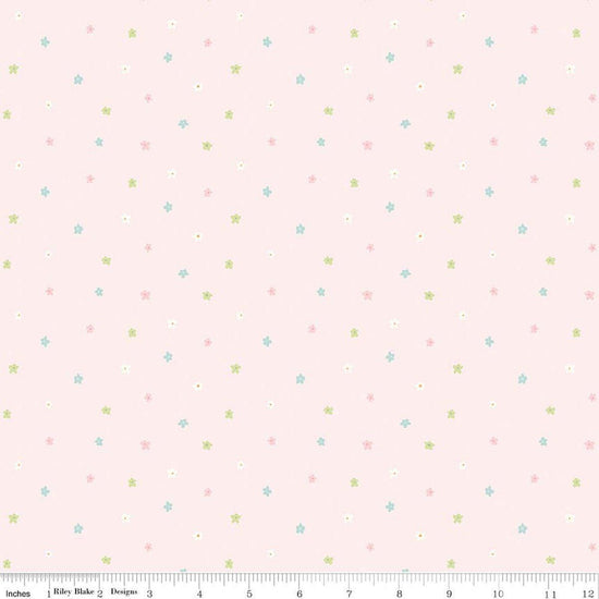 Image of Little Posies Ditsy Pink quilting cotton fabric by Cayla Naylor for Riley Blake Designs. Features stars on a pink background. Cute Little Fabric Shop.