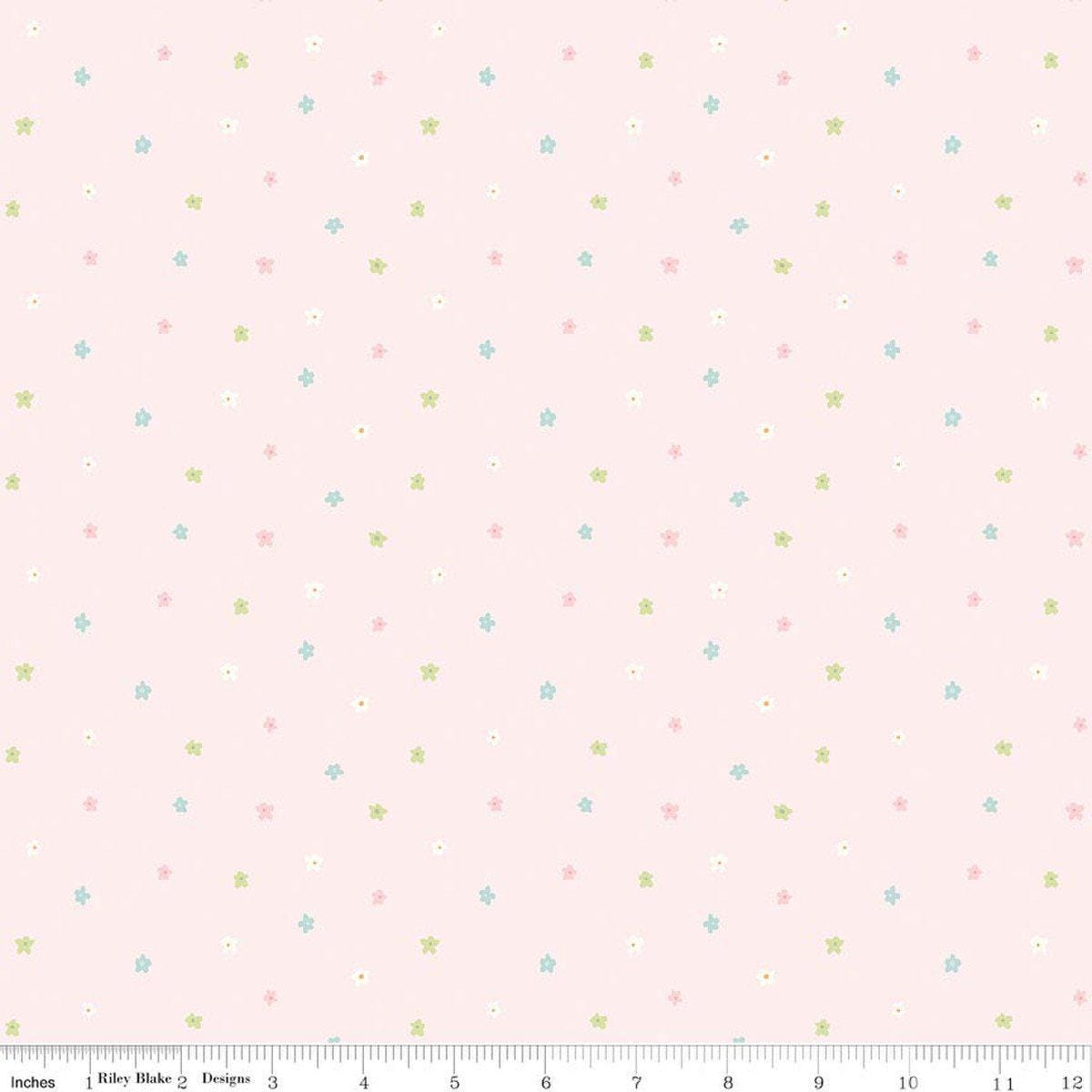 Image of Little Posies Ditsy Pink quilting cotton fabric by Cayla Naylor for Riley Blake Designs. Features stars on a pink background. Cute Little Fabric Shop.