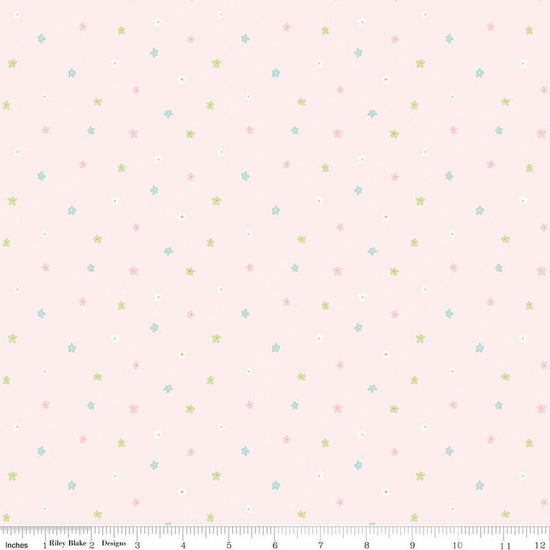 Image of Little Posies Ditsy Pink quilting cotton fabric by Cayla Naylor for Riley Blake Designs. Features stars on a pink background. Cute Little Fabric Shop.