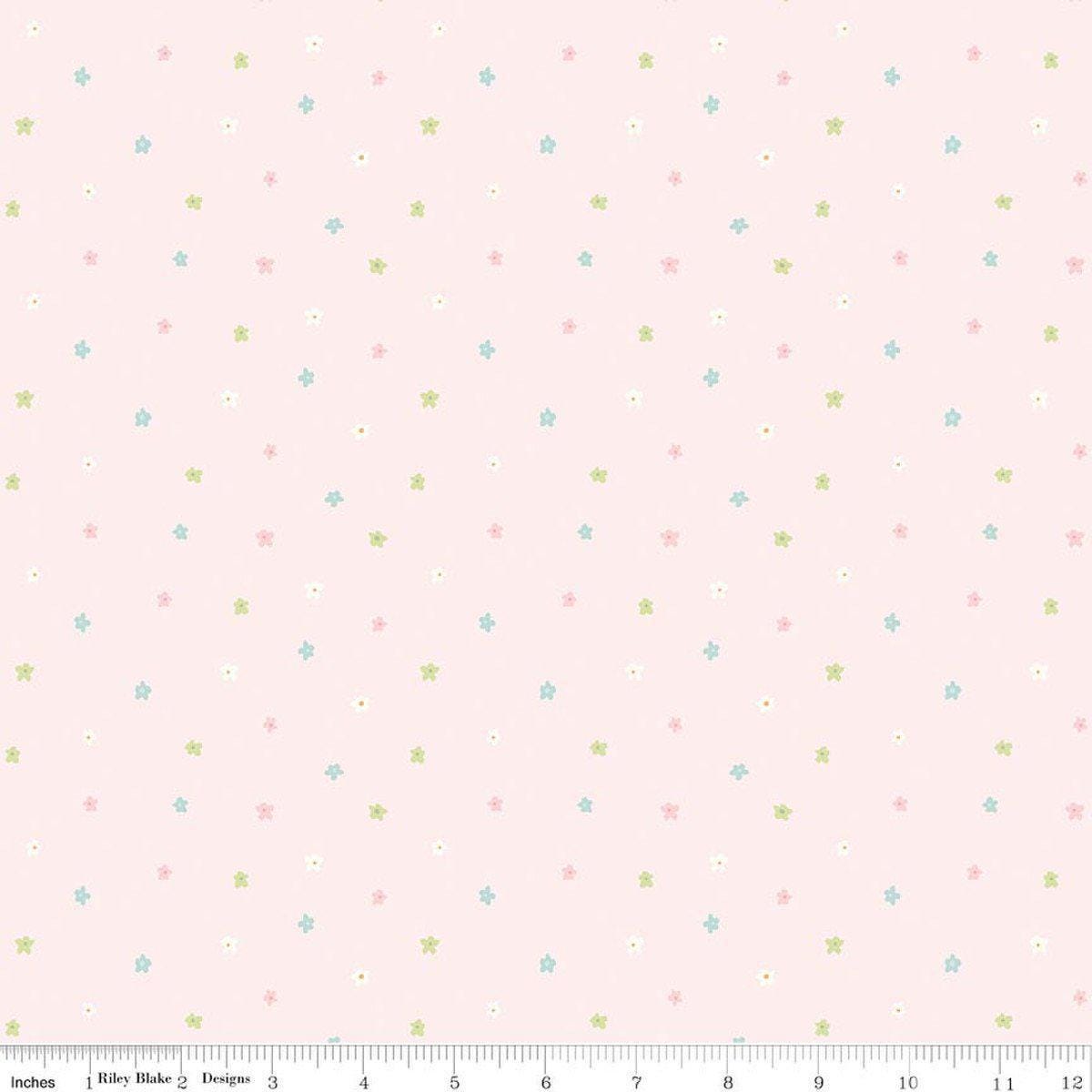 Image of Little Posies Ditsy Pink quilting cotton fabric by Cayla Naylor for Riley Blake Designs. Features stars on a pink background. Cute Little Fabric Shop.