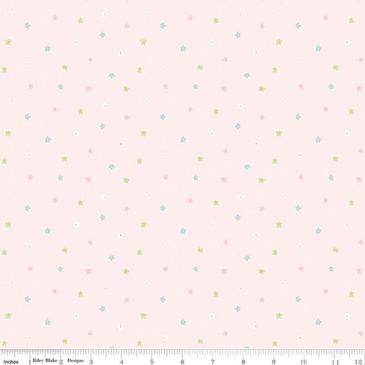 Image of Little Posies Ditsy Pink quilting cotton fabric by Cayla Naylor for Riley Blake Designs. Features stars on a pink background. Cute Little Fabric Shop.