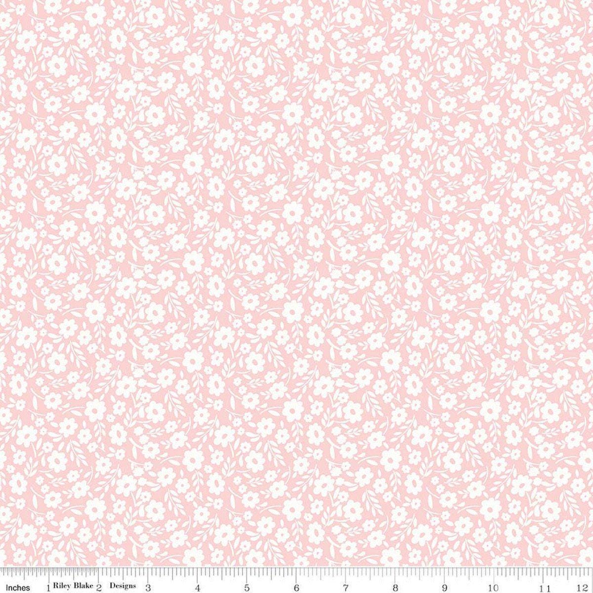 Image of Little Posies Floral Pink quilting cotton fabric by Cayla Naylor for Riley Blake Designs. Features flowers on a pink background. Cute Little Fabric Shop.