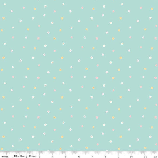 Image of Little Posies Ditsy Teal quilting cotton fabric by Cayla Naylor for Riley Blake Designs. Features stars on a blue background. Cute Little Fabric Shop.