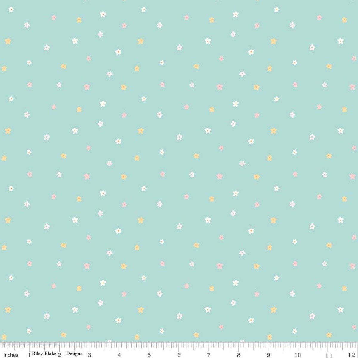 Image of Little Posies Ditsy Teal quilting cotton fabric by Cayla Naylor for Riley Blake Designs. Features stars on a blue background. Cute Little Fabric Shop.