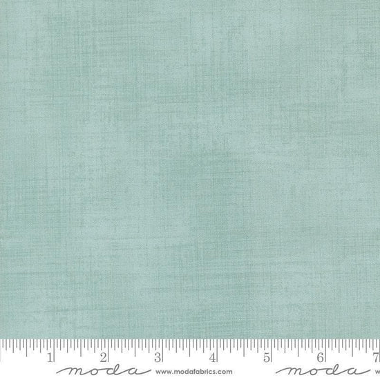 Image of Data Textured Solid Babbage quilting cotton fabric by Janet Clare for Moda Fabrics. Features printed solid texture on a blue background. Cute Little Fabric Shop.