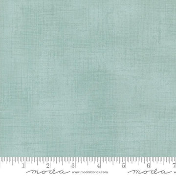 Image of Data Textured Solid Babbage quilting cotton fabric by Janet Clare for Moda Fabrics. Features printed solid texture on a blue background. Cute Little Fabric Shop.