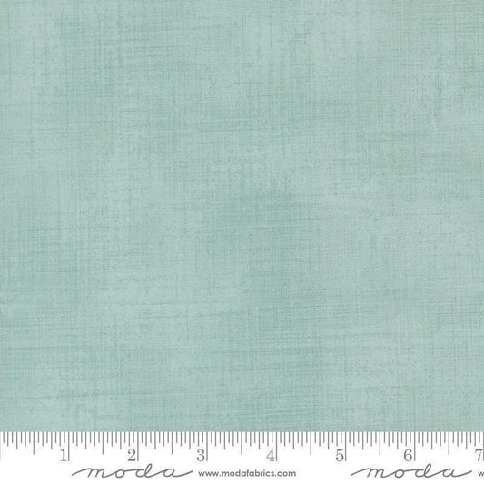 Image of Data Textured Solid Babbage quilting cotton fabric by Janet Clare for Moda Fabrics. Features printed solid texture on a blue background. Cute Little Fabric Shop.