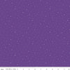 Image of Dapple Dot Iris quilting cotton fabric by The RBD Designers for Riley Blake Designs. Features polka dots on a purple background. Cute Little Fabric Shop.