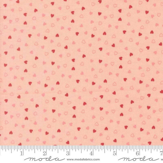 Image of Je Taime Sweetness Blush quilting cotton fabric by Stacy Iest Hsu for Moda Fabrics. Features hearts on a pink background. Cute Little Fabric Shop.