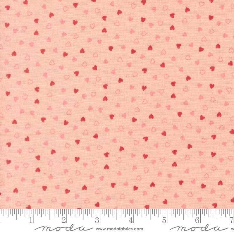Image of Je Taime Sweetness Blush quilting cotton fabric by Stacy Iest Hsu for Moda Fabrics. Features hearts on a pink background. Cute Little Fabric Shop.