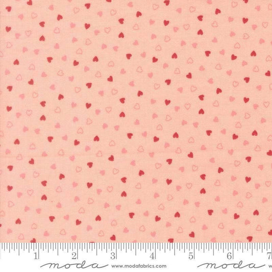 Image of Je Taime Sweetness Blush quilting cotton fabric by Stacy Iest Hsu for Moda Fabrics. Features hearts on a pink background. Cute Little Fabric Shop.