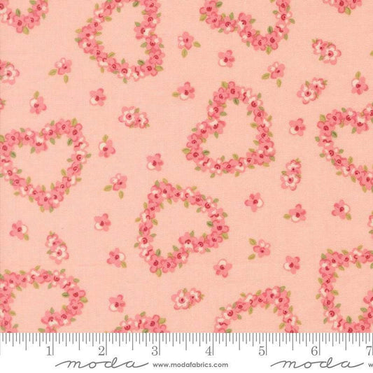 Image of Je Taime Flower Heart Blush quilting cotton fabric by Stacy Iest Hsu for Moda Fabrics. Features flowers on a pink background. Cute Little Fabric Shop.