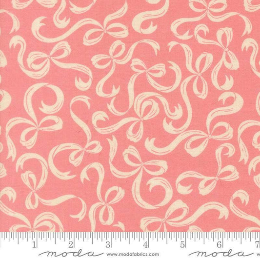 Image of Je Taime Tie a Bow Blossom quilting cotton fabric by Stacy Iest Hsu for Moda Fabrics. Features bows on a pink background. Cute Little Fabric Shop.