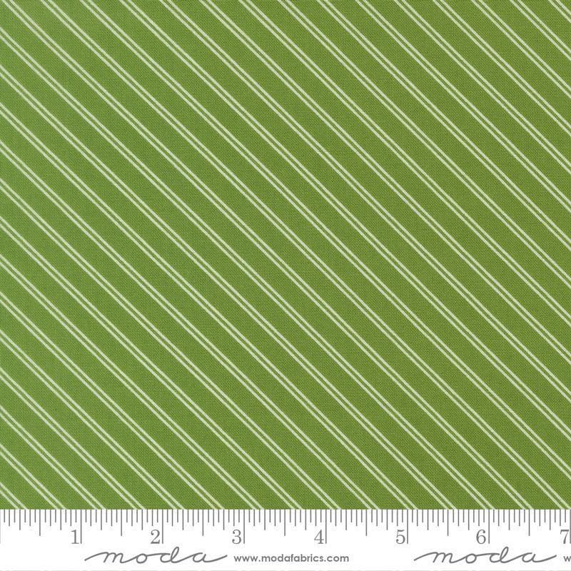 Image of Bloomsberry Stripe Green quilting cotton fabric by Camille Roskelley for Moda Fabrics. Features stripes on a green background. Cute Little Fabric Shop.